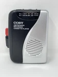 Coby CVR-28-BLK Am/fm Cassette Recorder Black, Tested, 2AA Batt Not Included. Fixed Price $14.97.