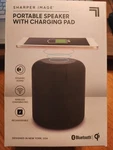 Brand New Sharper Image Portable Speaker With Charging Pad Bluetooth SBT598BK. Fixed Price $10.99.