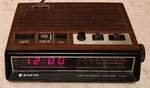 Vintage Sanyo Alarm Clock Am/fm Radio Wood Grain Model Number 5500A. Fixed Price $34.99.