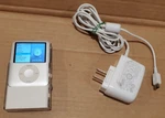 Creative Travel Sound Docking & External Portable Speaker + Apple Ipod Nano 4GB. Fixed Price $59.89.