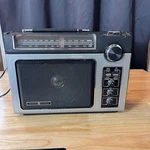 Vtg Superadio 7-2880B Am Fm Portable Long Range Black Silver Ac/dc. Fixed Price $64.99.