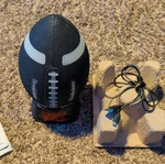 Brookstone Gronk Bluetooth Football Speaker Weatherproof Light-up. Fixed Price $45.00.