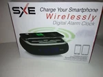 Wireless Phone Charging Pad & Alarm Clock Blue Led Display #SXE87001. Fixed Price $28.99.
