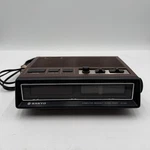 E2 Vintage Sanyo Alarm Clock Am/fm Radio Wood Grain Model Number 5500A. Fixed Price $60.00.